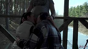 On our holiday, my neighbor and I sucked his big cock together in a public threesome