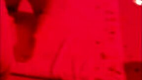 chubby brunette sits for big black dick in red light scene.