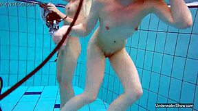 two hot lesbians splashing in the pool 😍