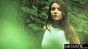 sexy green-eyed beauty masturbates outdoors in the forest