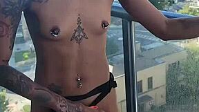 Kashofficials bent over on the balcony, getting her tight pussy strapped hard by renity love