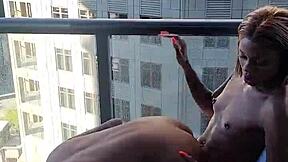 Kashofficials bent over on the balcony, getting her tight pussy strapped hard by renity love