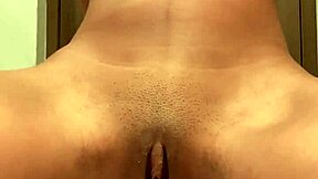 is this girl having fun masturbating in the bathroom?