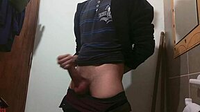 Skinny girl masturbates big cock in bathroom