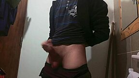 Skinny girl masturbates big cock in bathroom