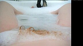 annie enjoys a comfy bubble bath with her body and monster toys