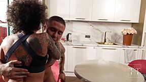 ebony bodybuilder licks wet pussy roughly, moaning in contrast to her assertiveness.
