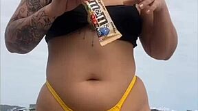 look at my swollen pussy in tight yellow bikini on beach