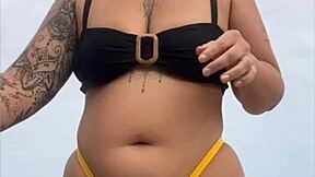 look at my swollen pussy in tight yellow bikini on beach