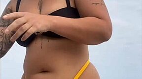 look at my swollen pussy in tight yellow bikini on beach