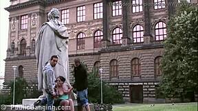 two guys picked up this cute teen girl and fucked her outdoors right by the famous statue in the city center.