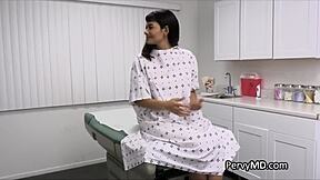 Latina patient receives doctor's medication from behind in a hospital setting.