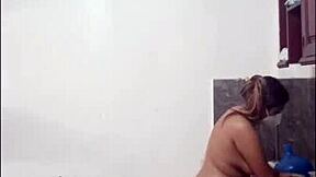 Cute and sexy curvy Latina woman cooking naked in kitchen