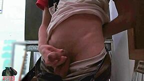 Skinny guy masturbates with big cock in shop backroom