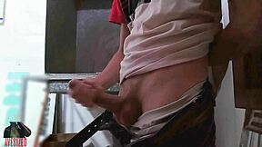 Skinny guy masturbates with big cock in shop backroom