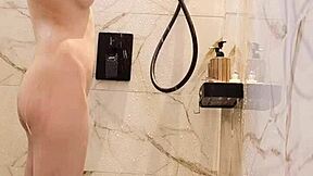 Bathing black-haired Japanese girl with ponytail and small tits