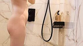 Bathing black-haired Japanese girl with ponytail and small tits