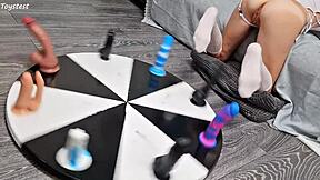 i love how my petite stepsister earns her orgasm with that wheel of dildos game