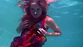 uh, redhead b nikita vodorezova strips naked real quick underwater at the beach or pool... like super fast ya know?