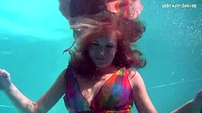 uh, redhead b nikita vodorezova strips naked real quick underwater at the beach or pool... like super fast ya know?