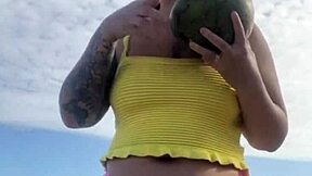 Hey, check out this young exhibitionist flashing her puffy pussy lips in bikini at the beach