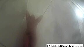 In a steamy shower scene, sexy blonde Dahlia indulges in naughty solo masturbation fun.