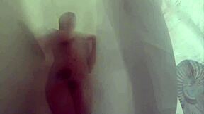 In a steamy shower scene, sexy blonde Dahlia indulges in naughty solo masturbation fun.