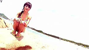 skinny japanese chick poses in bikini during outdoor photoshoot on the beach with close up shots