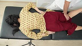 Young Indian student receives relaxing homemade massage in cute uniform