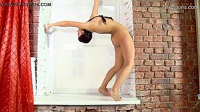Sexy brunette teen 18+ Tonya Bellucci shows off her flexible gymnast body. She spreads legs wide in acrobatic nude poses.