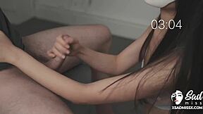 Handjob from sadmiss helps her lover to cum on her face in asian scene