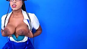 Hey check out this cute young busty babe with gigantic black nipples squeezing her natural tits after class