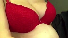 look at my milky tits, says the pregnant stepmother pulling them from her red bra
