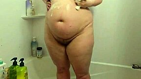 Whoa, hidden cam catches this curvy bbw milf soaking wet in the shower, all candid and voyeur-style! 🚿😲