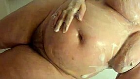 Whoa, hidden cam catches this curvy bbw milf soaking wet in the shower, all candid and voyeur-style! 🚿😲