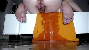 In this homemade video, a cute teen experiences squirting orgasm while masturbating solo in the bathtub for her partner