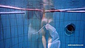 redhead marketa teases in white dress by the pool