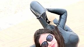 Latex flexi doll stretches in catsuit for outdoor fetish fun