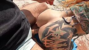 In a deserted beach, naughty girls engage in a hot orgy with kissing and cunilingus.