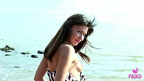 i had so much fun as tanned juliette stripping naked fingering my hairy pussy at the beach