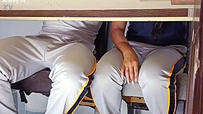 In a forbidden classroom game, the hot college girl flashes her uniform. She rides the desk wildly in a quickie with her student friend.