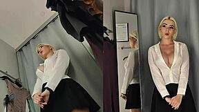 I spy upskirt on naked blonde with big tits trying see-through clothes in changing room.