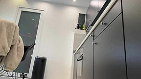 Blonde wife in kitchen teases with sheer black pantyhose and removes panties?