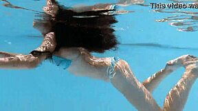 Skinny Hungarian teen Lana swims pool underwater showing juicy ass and small tits