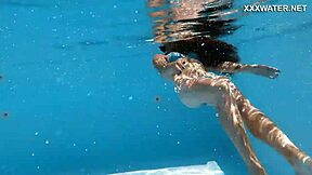 Skinny Hungarian teen Lana swims pool underwater showing juicy ass and small tits