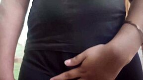 In a cozy bedroom, the cute young Indian couple shares sweet kisses and tender romantic moments together as loving husband and beautiful housewife.