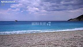 Mona Blue Lounges Solo on Public Beach Outdoors