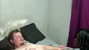 Boss chills with ebony maid's footjob blowjob while wife works