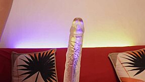 Skinny blonde teen rides see-through dildo deep in closeup on shaved pussy