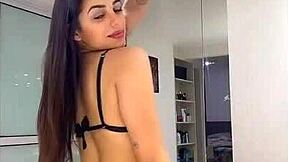 a hot young woman crams bikini deep into her big ass cheeks
